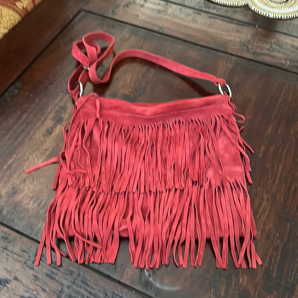 Leather red fringe cross body bag. Used. Suede.